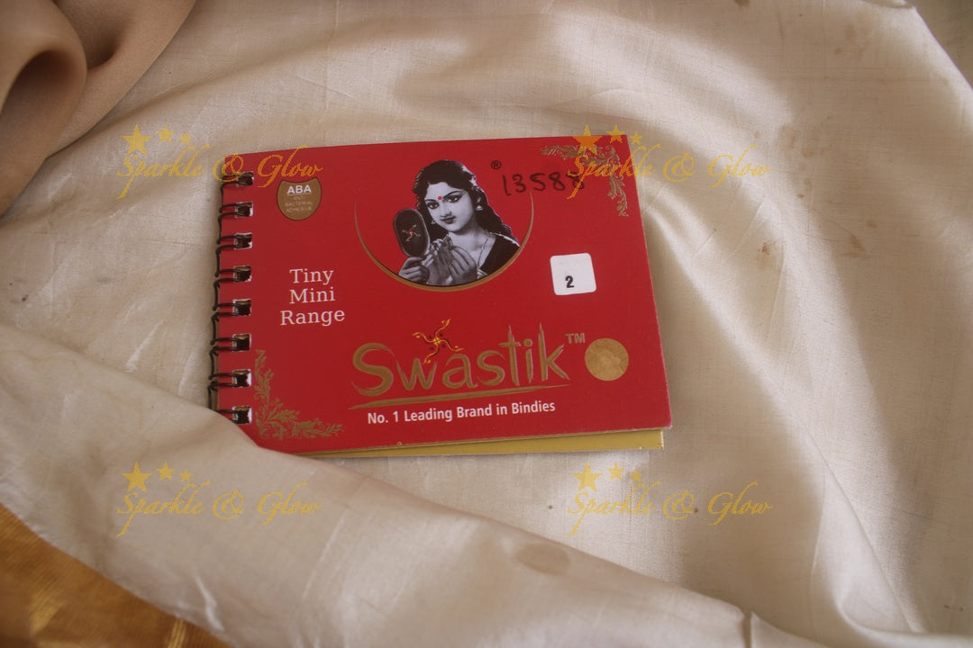 Swastik round stone 3D design and plain bindi with single size in spiral book in assorted colours - Sparkle and Glow