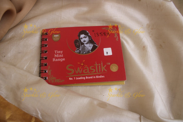 Swastik round stone 3D design and plain bindi with single size in spiral book in assorted colours - Sparkle and Glow