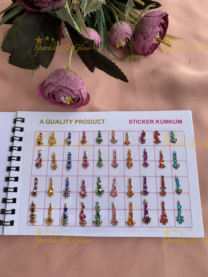 Navya stone and kundan bindi with different shape and size in spiral book in assorted colours