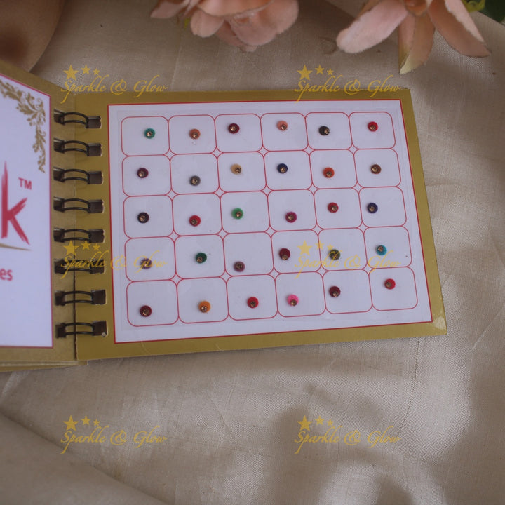 Swastik round single stone bindi with in spiral book in assorted colours