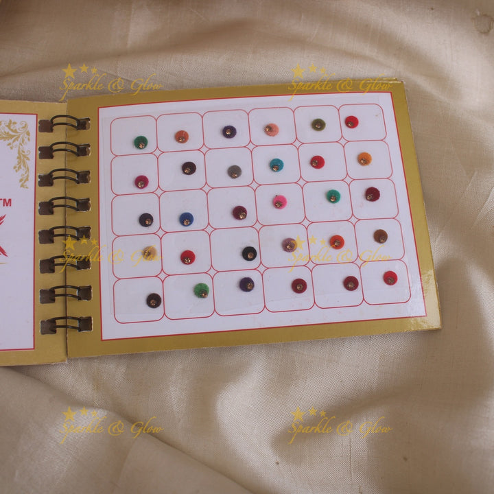 Swastik round single stone bindi with in spiral book in assorted colours - size 4