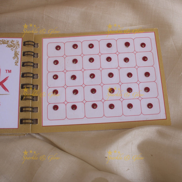 Swastik round single stone bindi with in spiral book in assorted colours - size 4