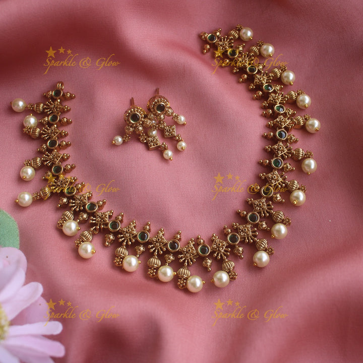 Statement Floral design short necklace with emerald stones gold beads and pearl drops