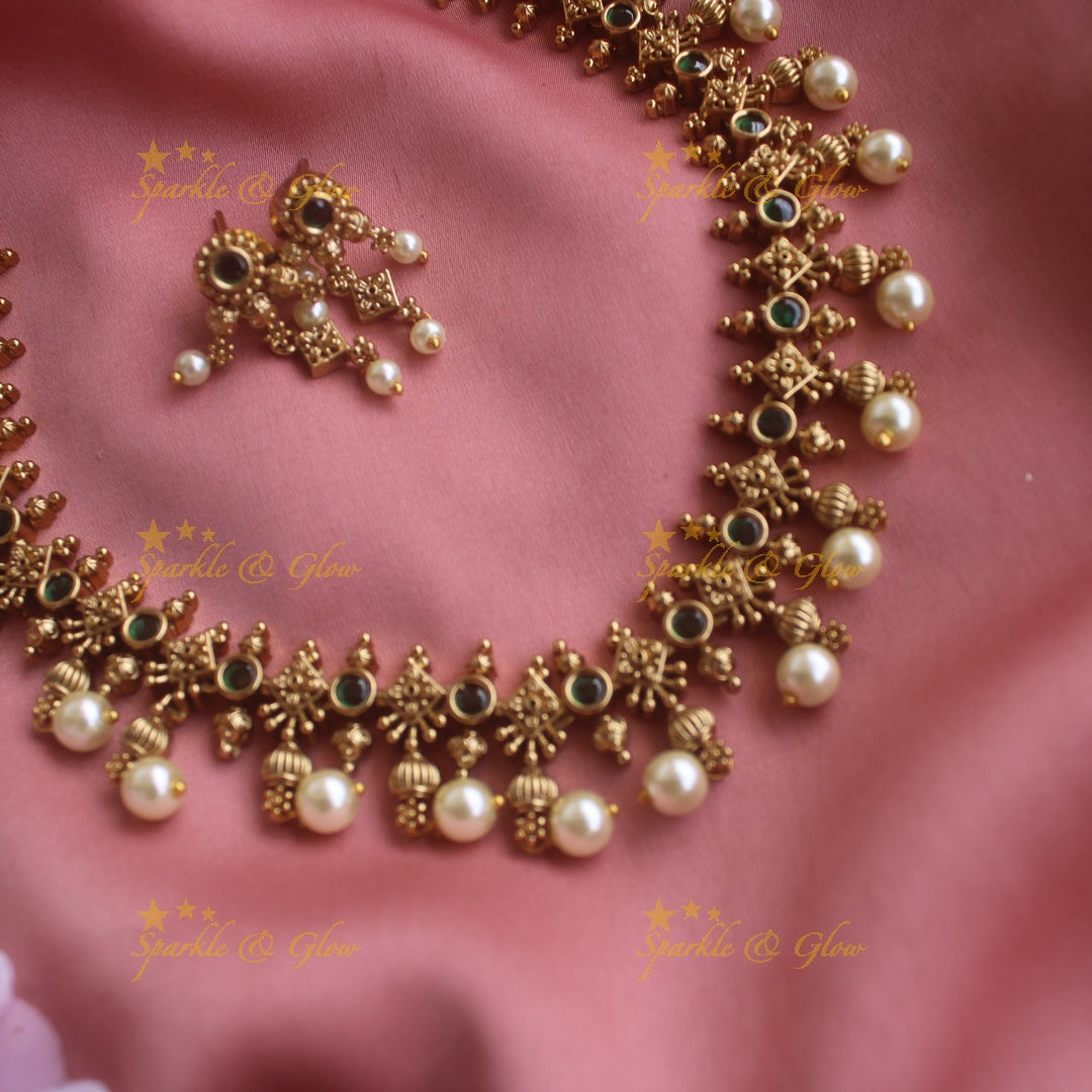 Statement Floral design short necklace with emerald stones gold beads and pearl drops