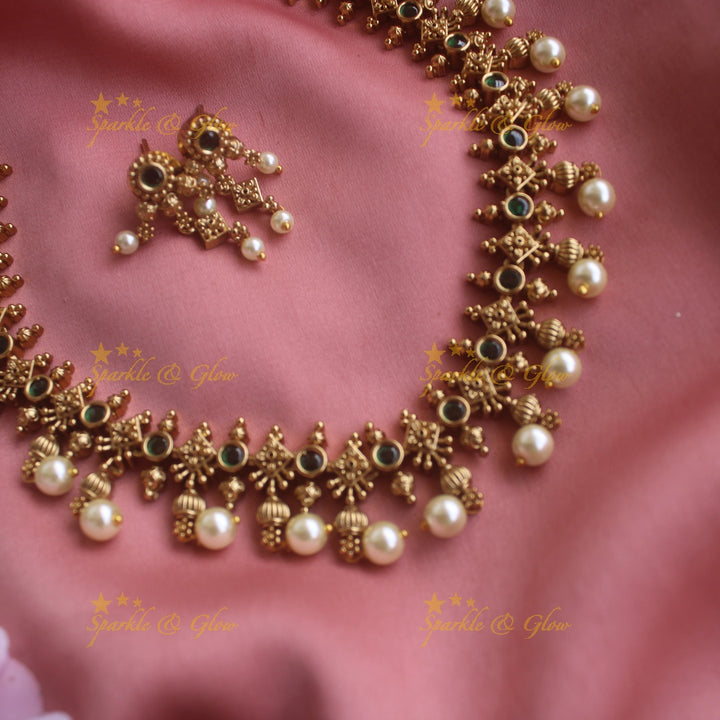 Statement Floral design short necklace with emerald stones gold beads and pearl drops