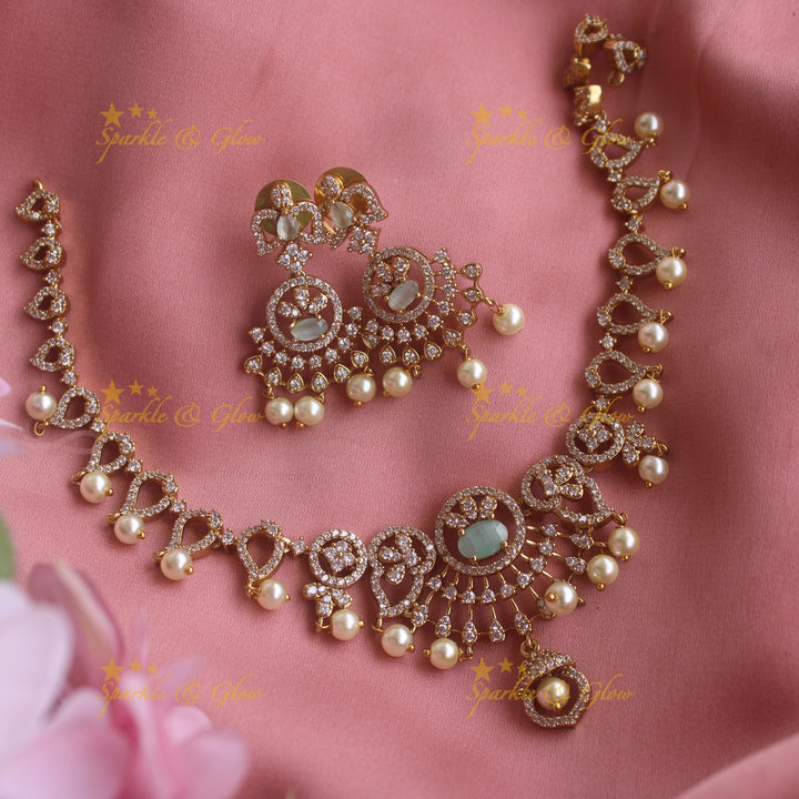 Sparkling Floral and mango design AD short necklace with sea blue stones and pearl drops