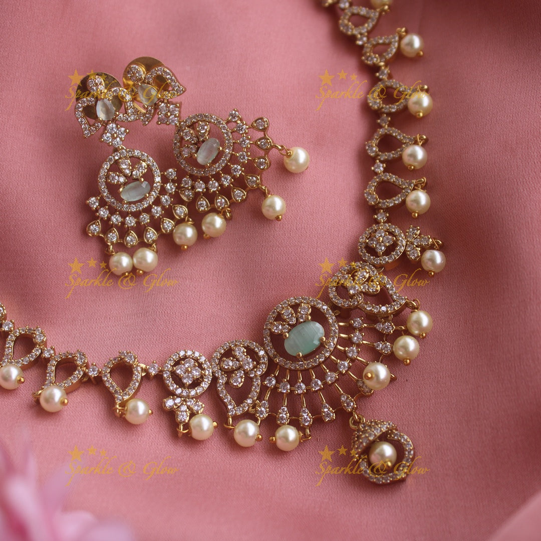 Sparkling Floral and mango design AD short necklace with sea blue stones and pearl drops
