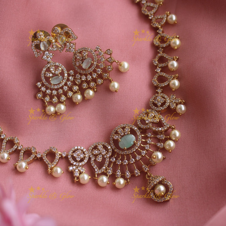 Sparkling Floral and mango design AD short necklace with sea blue stones and pearl drops