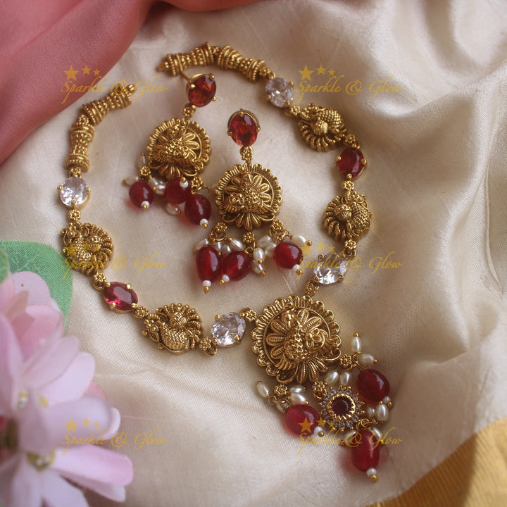 Elegant Lakshmi carved short necklace with oval stones and maroon beads