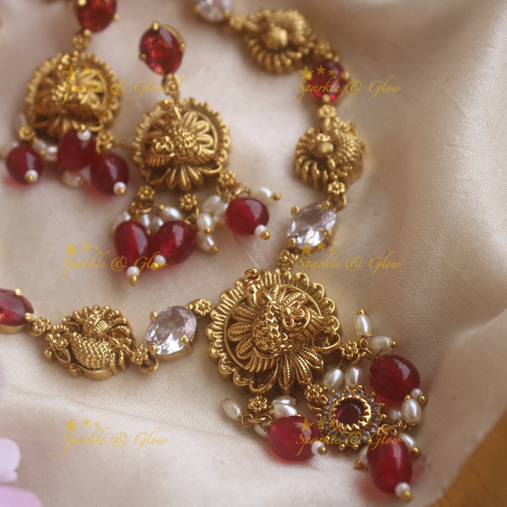 Elegant Lakshmi carved short necklace with oval stones and maroon beads