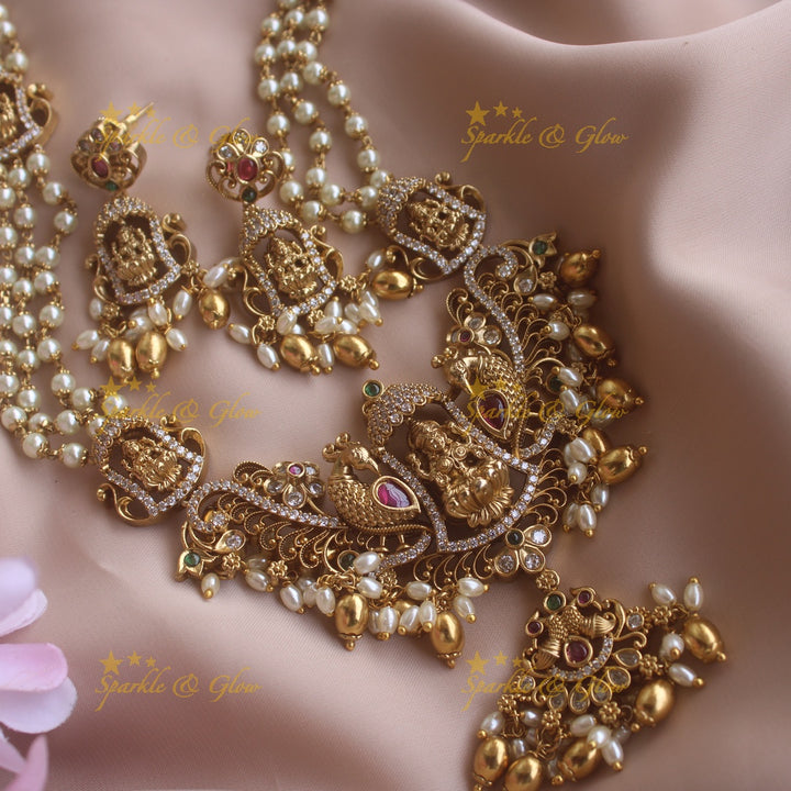 Gorgeous Lakshmi peacock pendant haram with multi layer pearl chain CZ stones and gold beads