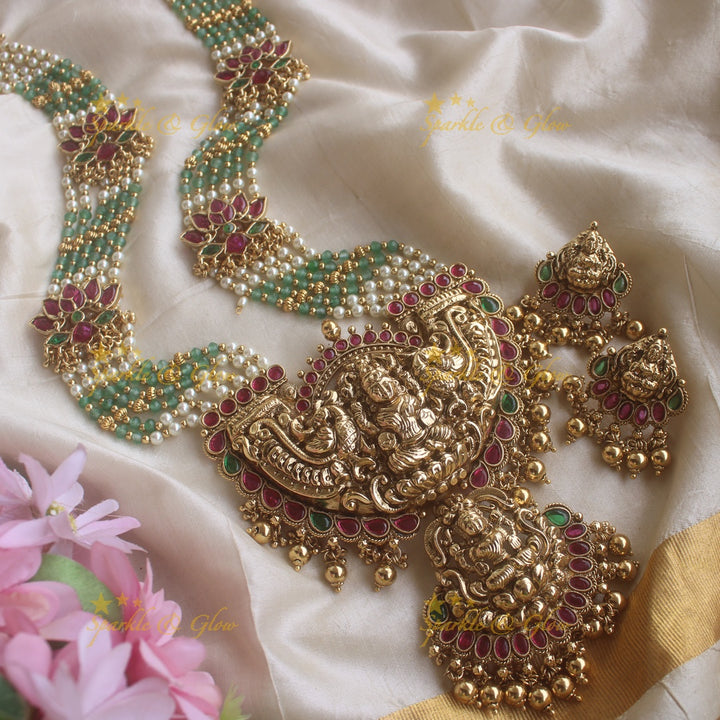 Stunning Lakshmi pendant lotus design haram with multi layer pearl and mint green beads chain