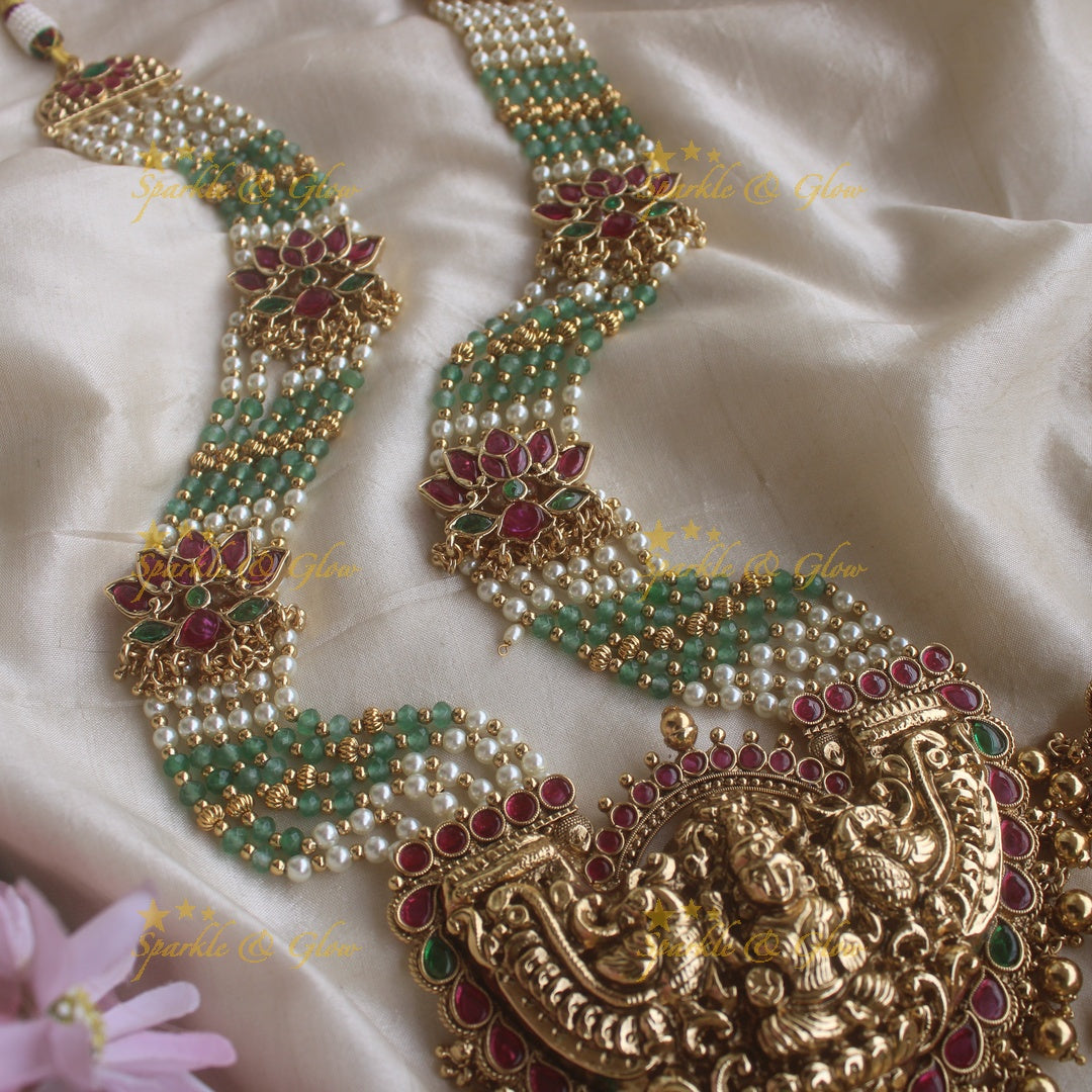 Stunning Lakshmi pendant lotus design haram with multi layer pearl and mint green beads chain