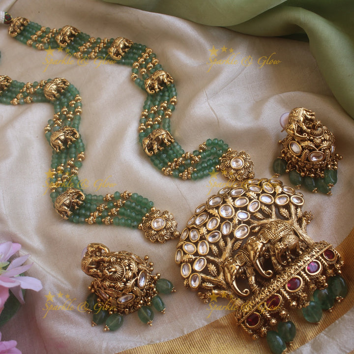 Elegant Elephant and tree design pendant haram with multi layer gold and mint green beads chain and stones
