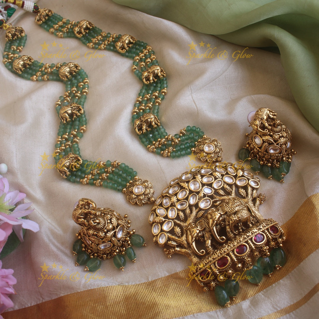 Elegant Elephant and tree design pendant haram with multi layer gold and mint green beads chain and stones