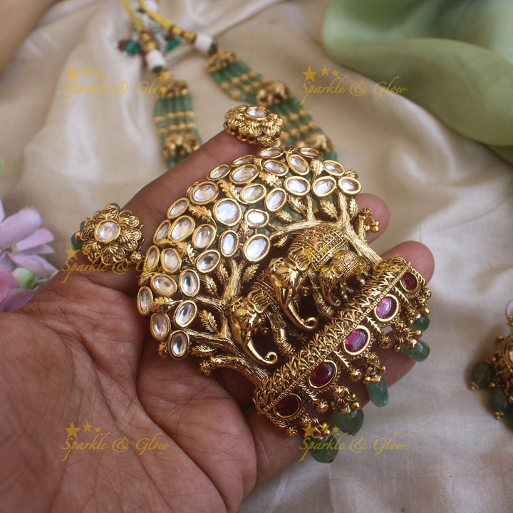 Elegant Elephant and tree design pendant haram with multi layer gold and mint green beads chain and stones