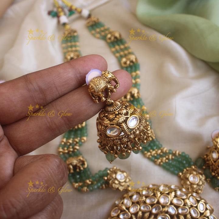 Elegant Elephant and tree design pendant haram with multi layer gold and mint green beads chain and stones