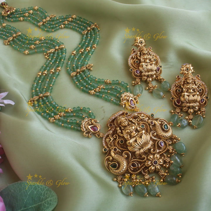 Beautiful Lakshmi peacock carved pendant haram with multi layer gold and coral beads chain and stones