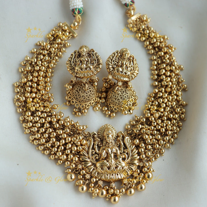 Elegant Lakshmi carved Cluster Gold short necklace with mint green beads