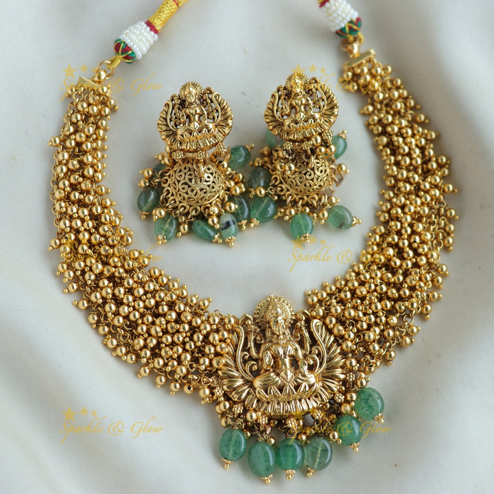 Elegant Lakshmi carved Cluster Gold short necklace with mint green beads