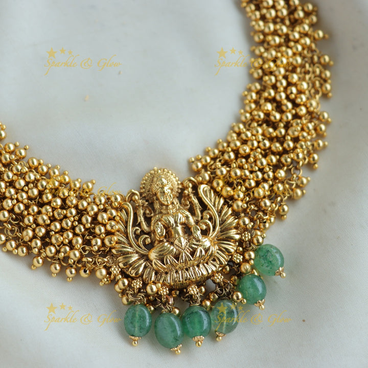 Elegant Lakshmi carved Cluster Gold short necklace with mint green beads