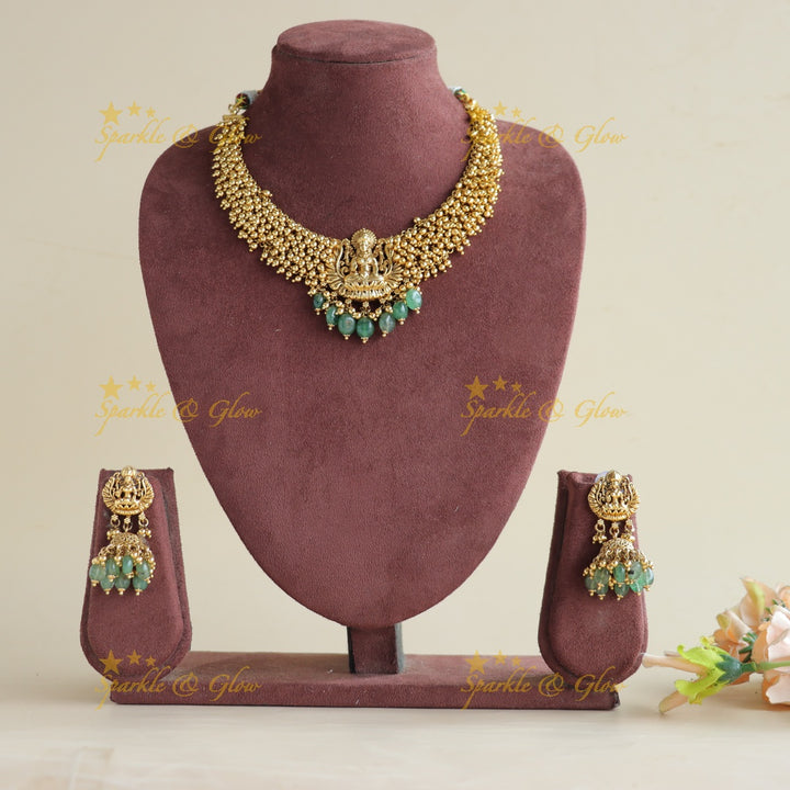 Elegant Lakshmi carved Cluster Gold short necklace with mint green beads