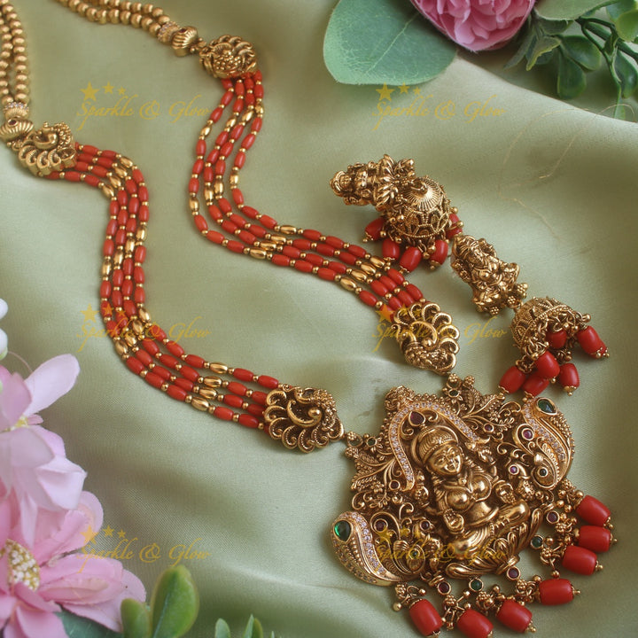 Gorgeous Lakshmi peacock carved pendant haram with multi layer gold and coral beads chain and stones