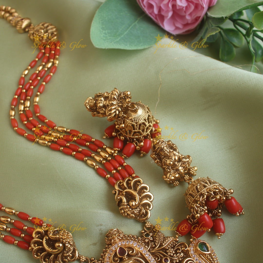 Gorgeous Lakshmi peacock carved pendant haram with multi layer gold and coral beads chain and stones