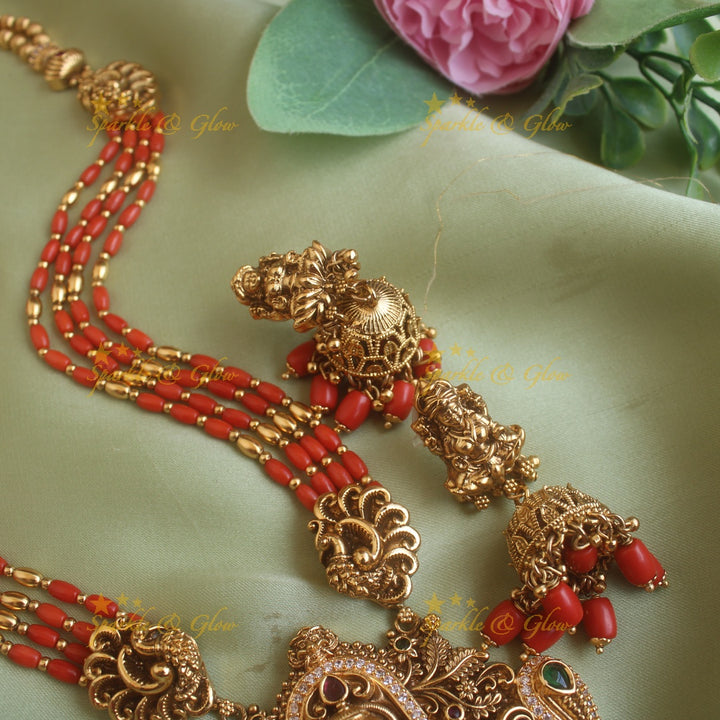 Gorgeous Lakshmi peacock carved pendant haram with multi layer gold and coral beads chain and stones