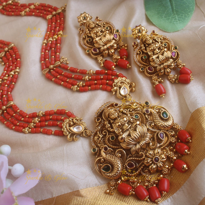 Beautiful Lakshmi peacock carved pendant haram with multi layer gold and coral beads chain and stones