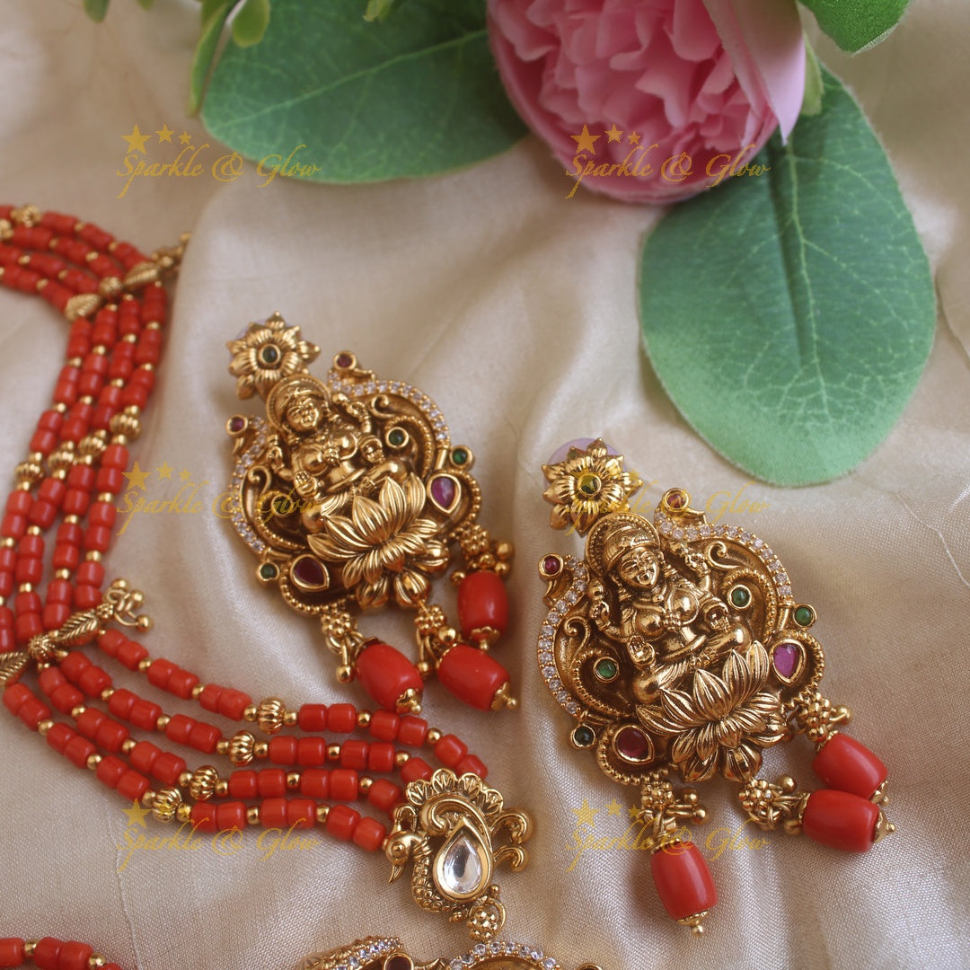 Beautiful Lakshmi peacock carved pendant haram with multi layer gold and coral beads chain and stones