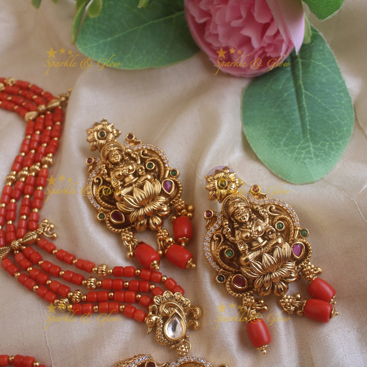 Beautiful Lakshmi peacock carved pendant haram with multi layer gold and coral beads chain and stones
