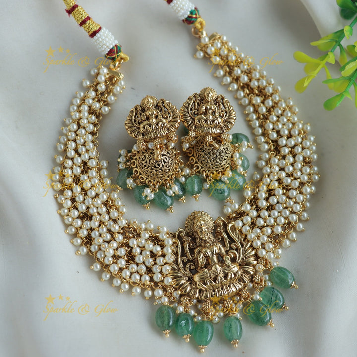 Elegant Lakshmi carved Cluster Gold short necklace with mint green beads