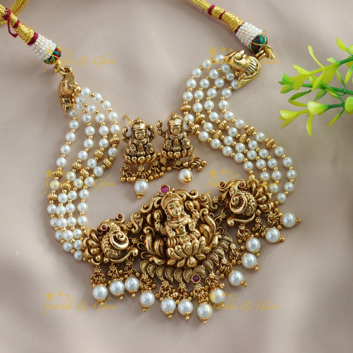 Elegant Lakshmi Peacock carved choker with multi layer pearl and pearl drops