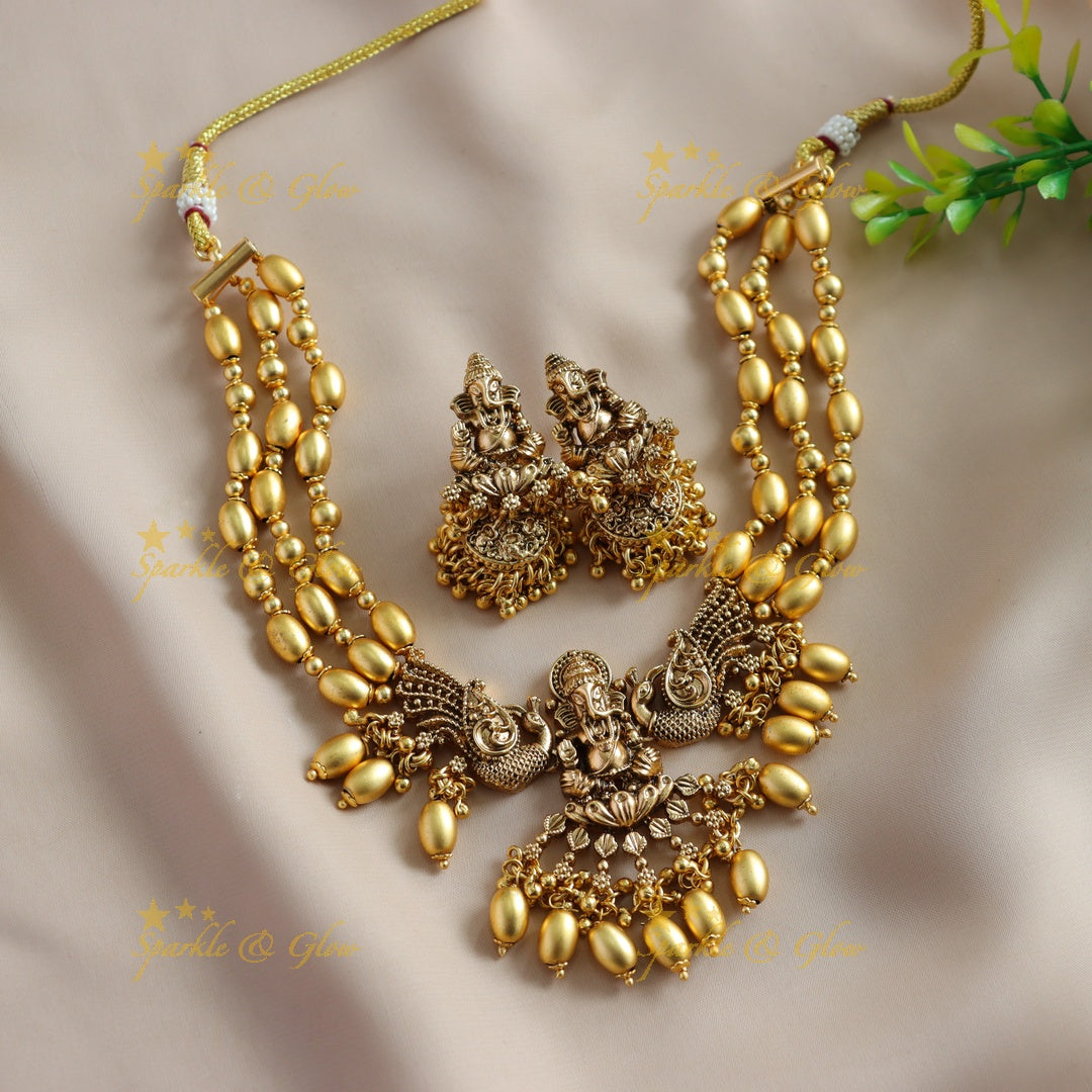 Beautiful Ganesha peacock carved high neck choker with multi layer gold beads