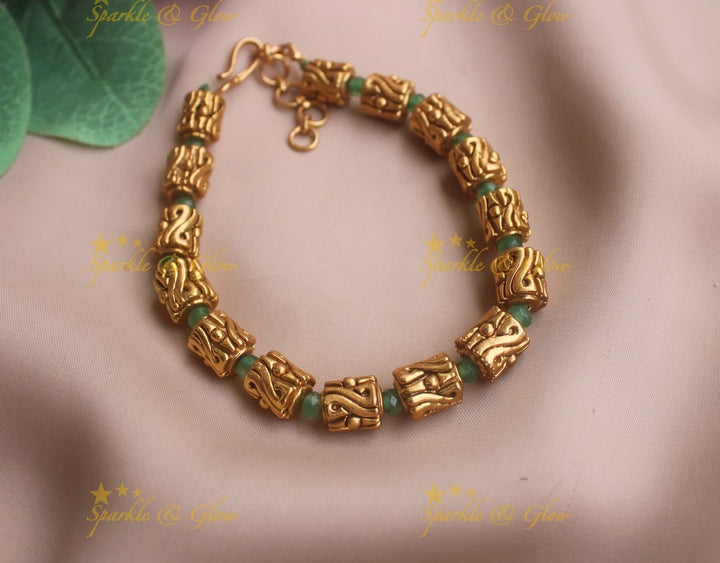 Intricately carved gold box design bracelet