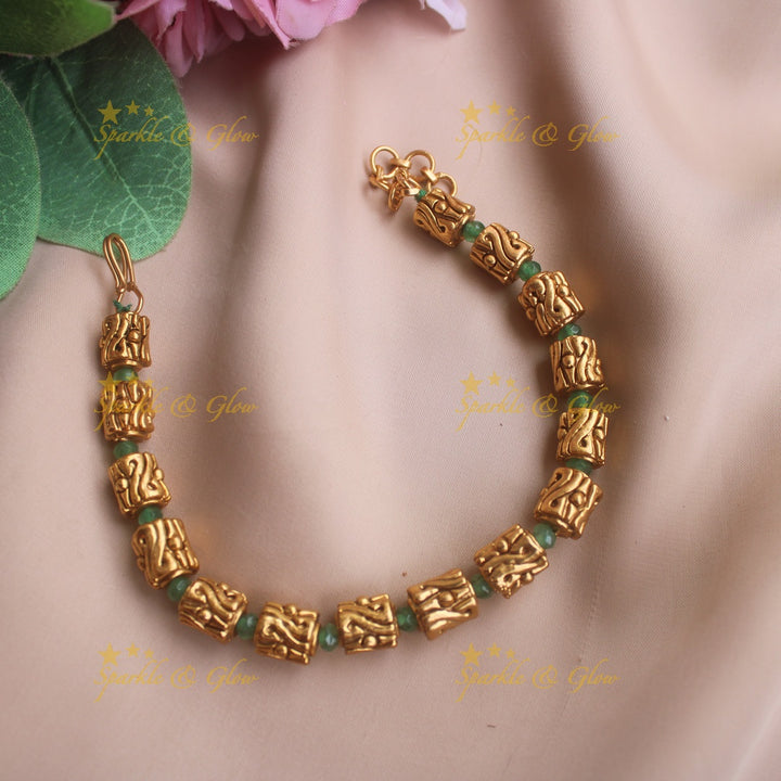 Intricately carved gold box design bracelet