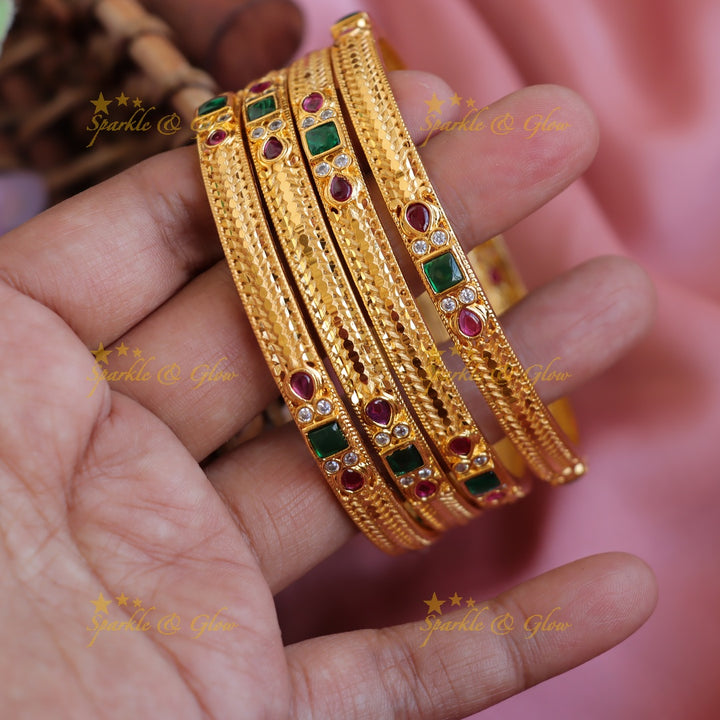 Statement Gold polished bangles with ruby and emerald two pairs,  2.4