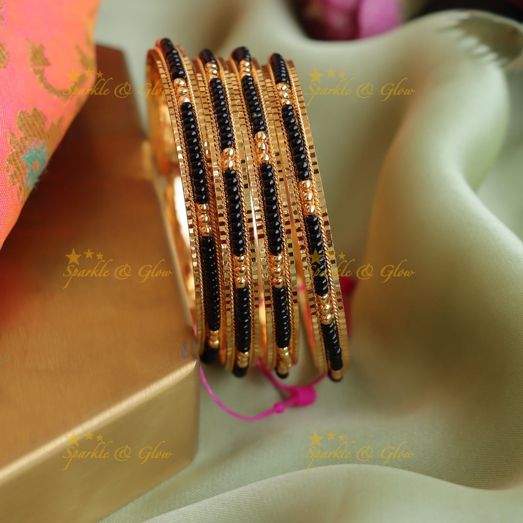 Beautiful Gold and Black beads bangles two pairs, 2.4