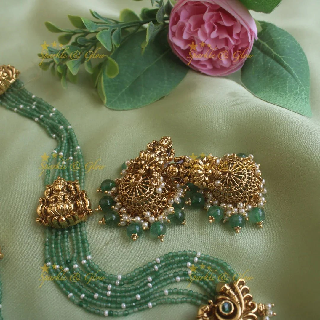 Gorgeous Lakshmi peacock carved pendant haram with multi layer mint green beads chain ruby stones and pearls - Sparkle and Glow