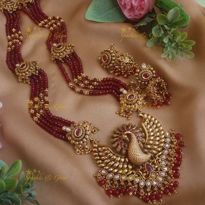 Stunning Peacock carved pendant haram with multi layer gold and maroon beads chain and stones - Sparkle and Glow