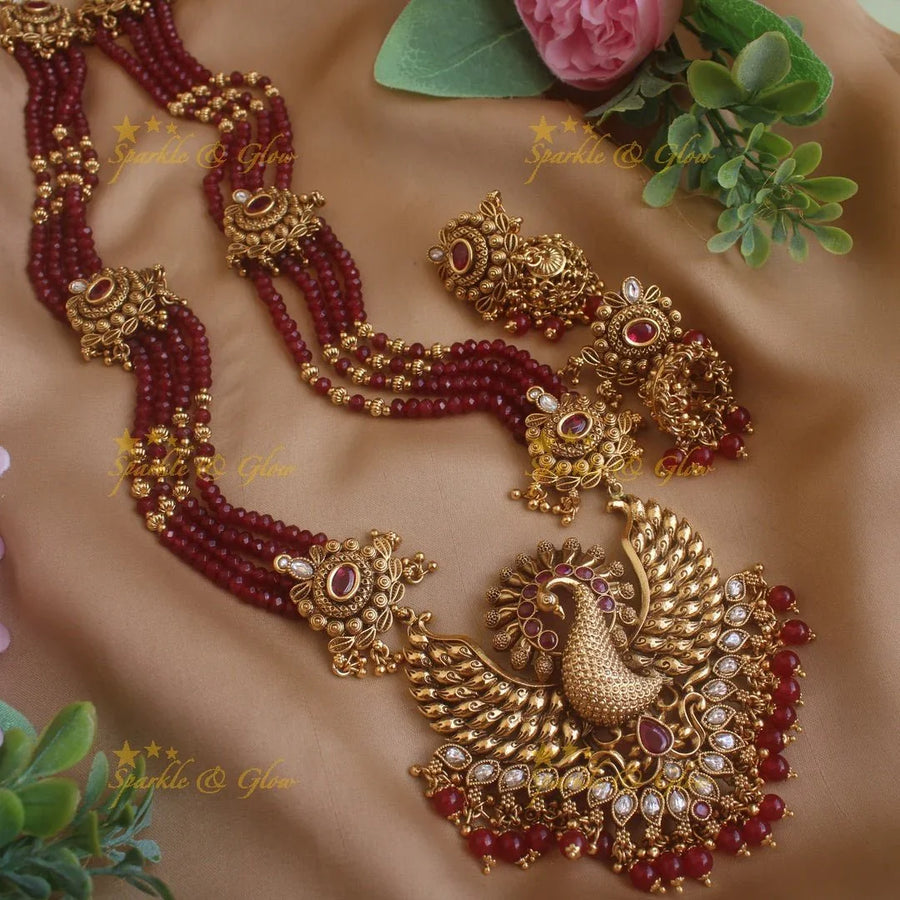 Stunning Peacock carved pendant haram with multi layer gold and maroon beads chain and stones - Sparkle and Glow