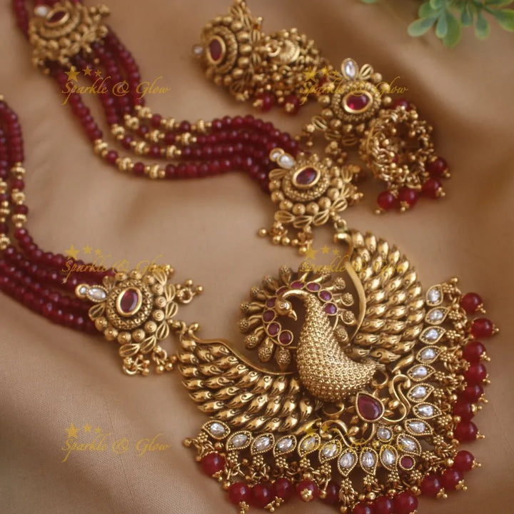 Stunning Peacock carved pendant haram with multi layer gold and maroon beads chain and stones - Sparkle and Glow