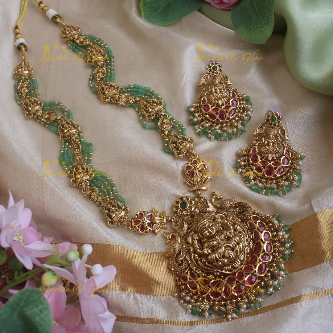 Gorgeous Lakshmi peacock and floral design haram with multi layer gold and mint green beads chain and ruby stones - Sparkle and Glow