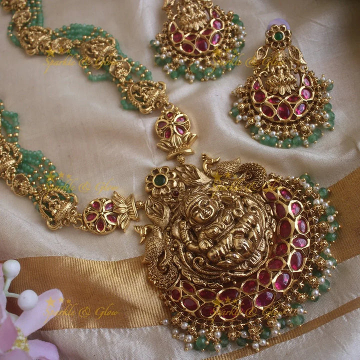 Gorgeous Lakshmi peacock and floral design haram with multi layer gold and mint green beads chain and ruby stones - Sparkle and Glow