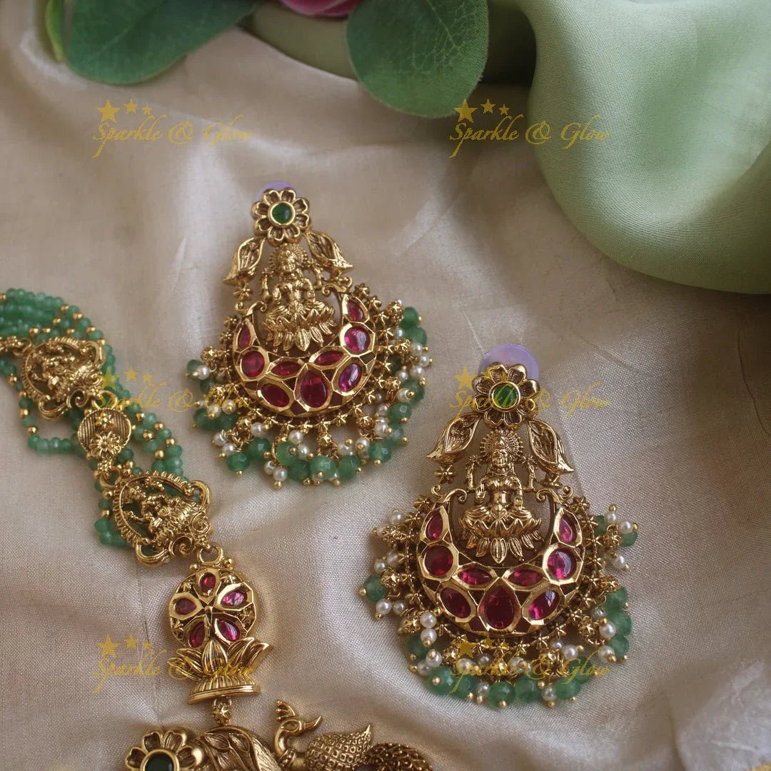 Gorgeous Lakshmi peacock and floral design haram with multi layer gold and mint green beads chain and ruby stones - Sparkle and Glow