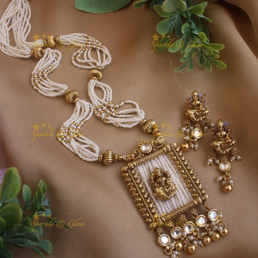 Stunning Lakshmi carved rectangle pendant haram with multi layer gold beads and pearl chain and stones - Sparkle and Glow