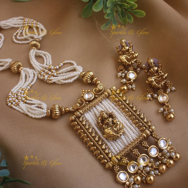 Stunning Lakshmi carved rectangle pendant haram with multi layer gold beads and pearl chain and stones - Sparkle and Glow