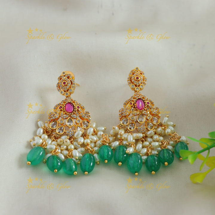 Elegant Lakshmi mango design AD short necklace with ruby emerald rice pearls and green beads