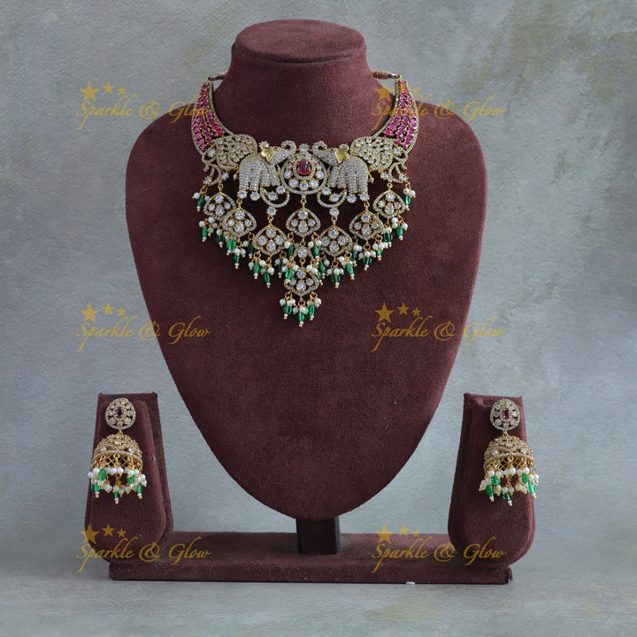 Beautiful Elephant and leaf design AD short necklace with ruby pearls and green beads